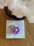 Porte Clé silicone Mauve centre fleuri