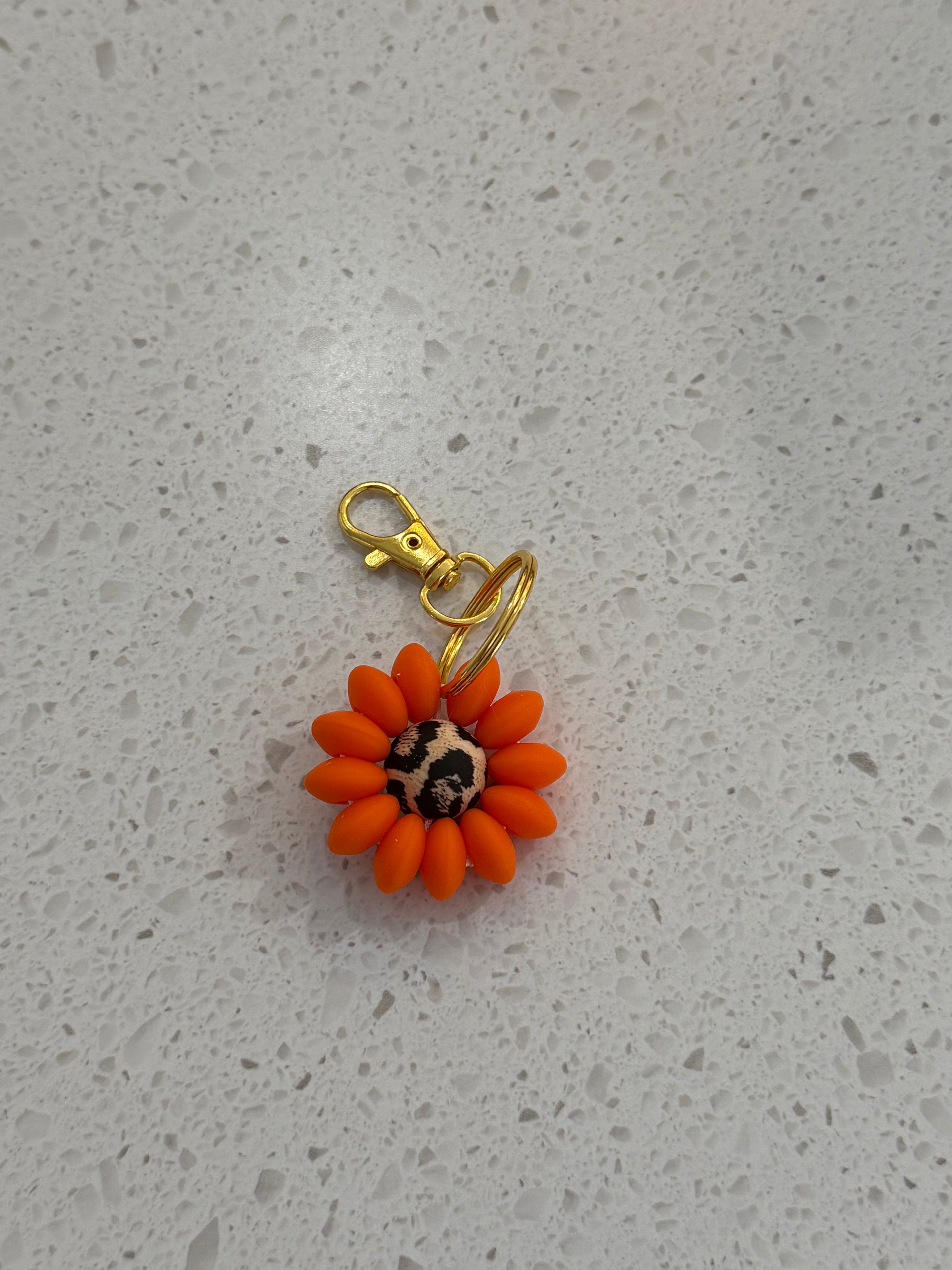 Porte Clé silicone Marguerite Orange centre léopard